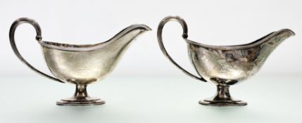 A pair of George III Scottish silver sauce boats, William Davie, Edinburgh 1782 and 1783, each