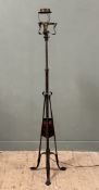 An Arts & Crafts hammered metal standard lamp, c. 1900, with scroll-cast shade support, the