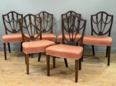 A set of six George III style mahogany dining chairs in the Hepplewhite taste, c. 1900, each