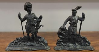 A pair of 19th century cast-iron doorstops, modelled as Highland soldiers. Heights 35cm and 36cm (