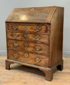 An early George III mahogany bureau, the slant front opening to a leather-inset writing surface