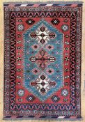 A fine hand-knotted Persian Yalameh rug, central field with three geometric medallions within