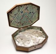 A 19th century satinwood box of shaped octagonal form, the cover with parquetry inlay, opening to