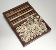 A large set of early/ mid-19th century engraved bone spelling tiles, with Capital and Lower Case