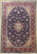 A fine hand-knotted Persian Sarouk carpet, central field with floral medallion scrolling palmettes
