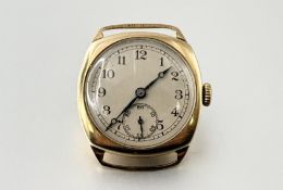 A 1930's yellow metal cushion-cased gentleman's wristwatch, the circular cream dial with Arabic