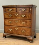 A fine George II crossbanded walnut bachelor's chest, of small proportions, the foldover leather-