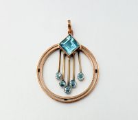 An Edwardian blue zircon pendant, set in rose-coloured metal (unmarked) of concentric circular