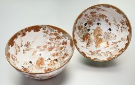 A pair of 19th century Japanese Kutani porcelain punch bowls, in a characteristic iron red palette