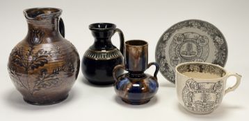 A collection of four decorative wares comprising, a scottish pottery twin handled treacle mottled