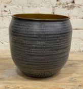 A modern metal planter, cylindrical form with blue geometric exterior and copper-effect interior: H.