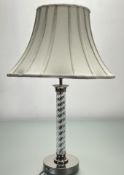 A Laura Ashley twisted table lamp with polished nickel base and top, complete with a cream bell lamp
