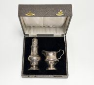 A George VI Birmingham silver strawberry set to comprise a baluster cream jug: h. x 7.5cm and a dome