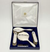 A George V Birmingham silver backed five piece dessing table set to include a comb: l. x 11cm, a