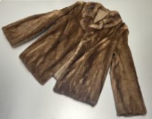 A 20thc short blonde mink fur coat, with hook and eye front fastenings (h. 70cm x inside arm l.
