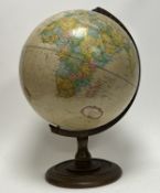 A late 20thc Replogle 12 Inch Diameter Globe, 'World Classic' series, on a circular base (h. 46cm)