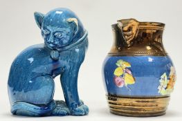 A turquoise glazed pottery model of a seated cat with bell to collar (chip to ear) (h-17cm) together