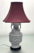 A latticework ceramic vase with blossom decoration in the Chinese style, converted to a table