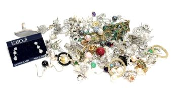A large collection of gilt metal, silver and white metal paste and coloured stone stud, hoop and