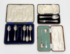 A George V Birningham silver christening set comprising a fluer de lis spoon: l. x 15.5cm and