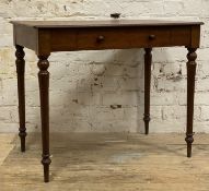 A Victorian mahogany writing table, rectangular top over frieze drawer, raised on turned tapered