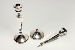 A pair of George V Birmingham silver hexagonal tapered weighted table candlesticks- one a/f: h. x