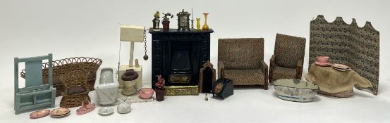 A collection of vintage doll's house furniture, comprising a wicker sofa and armchair with padded