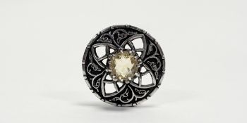 A Iona cast silver circular celtic beast open work brooch set circular facet cut pale citrine