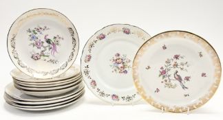 A collection of French Porcelain comprising five bowls and four plates decorated in the Limoge style