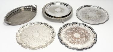 An epns circular cake stand in the Georgian taste with chased scrolling leaf and flower border