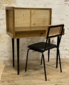 A modern hardwood and cane desk and chair, with bergere panels to top over frieze drawer, together