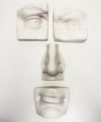 A silicone moulded plaster facial fragments og high relief, made up of the nose, lips and eyes. (4)