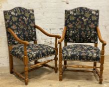 A pair of 20th century Jacobean-style armchairs, oak-framed with navy upholstery featuring floral