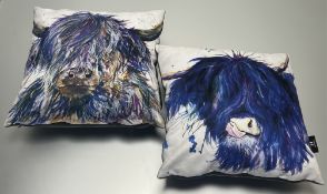 A near-matched pair of Katherine Williams Wraptous suede-effect pillows with inserts, each decorated