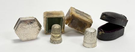 A continental white metal engine turned and engraved thinble in original case: h. x 2.5cm 3.3g