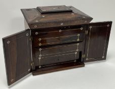 An early Victorian rosewood and mother of pearl ladies compendium of sarcophagus form, the top