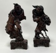 A pair of Chinese hand-carved fruitwood figures of the Immortals, one probably depicting Shoulao,