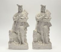 A pair of 19thc Stafforshire Scottish Piper flatback figures, losses to polychrome decoartion. (h-