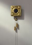 A Scottish Arts & Crafts brass wall clock, in the Glasgow style, c. 1900, square, the centre with