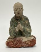 An early 20thc carved wooden Buddha decorated with polychrome enamels (h. 23cm)