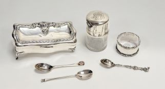 An Edward VII Chester silver ring box of rectangular serpentine form with chased harebell border and