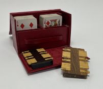 A Bezique card game cased within a red leather box by Webster's, 44 Dover Street, complete with