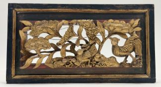 A late 19thc Chinese red lacquer and gold carved relief architectural panel, with carved birds