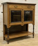 An Edwardian inlaid rosewood display cabinet, fitted with two frieze drawers over twin glazed