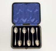 A George V Sheffield silver set of six rattail pattern coffee spoons: l. x 9.5cm in original blue
