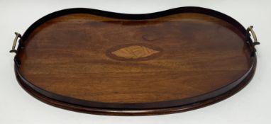 An Edwardian mahogany tray with inlay detail of a conch shell and raised gallery, finished with