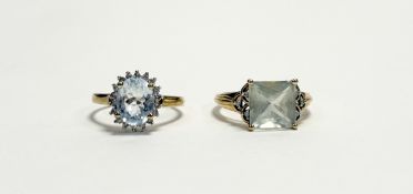 A 9ct gold QVC ring set cushion square cut pale peridot approximately 3ct flanked by three diamond