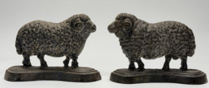 A pair of 19thc heavy cast iron doorstops, in the form of rams. (h-16cm l-23cm) (2)
