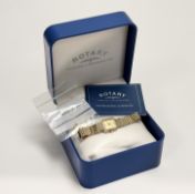 A Rotary 9ct gold tank style quartz wristwatch with gilt dial and baton hour markers on 9ct gold