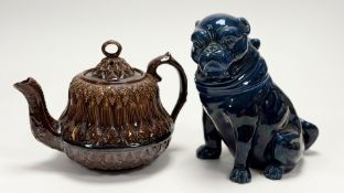 A treacle glazed teapot, in a moudled diamond and collum relief design with loop to cover (h-18cm)